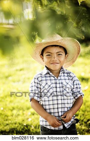 Hispanic boy smiling outdoors View Large Photo Image Stock Photograph - Hispanic boy smiling outdoors. Fotosearch