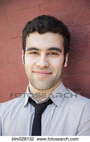 Hispanic businessman smiling outdoors View Large Photo Image Stock Image - Hispanic businessman smiling outdoors. Fotosearch