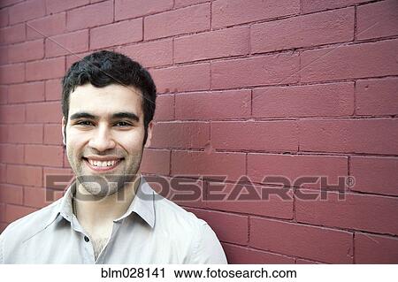Hispanic man smiling outdoors View Large Photo Image Stock Image - Hispanic man smiling outdoors. Fotosearch