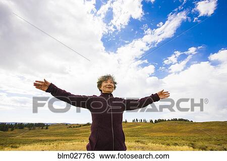 Japanese woman standing in rural landscape, Yellowstone, Wyoming, United States View Large Photo Image Stock Image - Japanese woman standing in rural landscape, Yellowstone, Wyoming, United States. Fotosearch