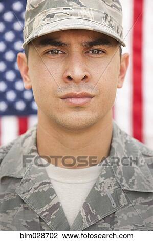 Mixed race soldier standing in front of United States flag View Large Photo Image Stock Image - Mixed race soldier standing in front of United States flag. Fotosearch