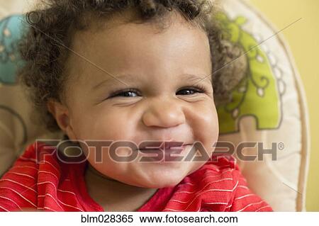 Stock Photography - Mixed race toddler boy smiling. Fotosearch
