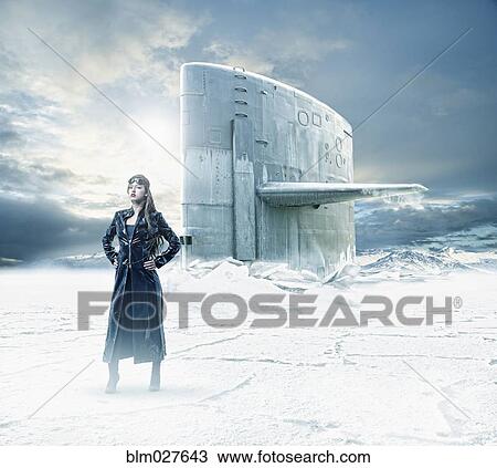 Stock Image - Mixed race woman on frozen landscape. Fotosearch