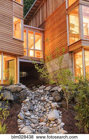 Stock Photo - Modern house and rocky creek. Fotosearch