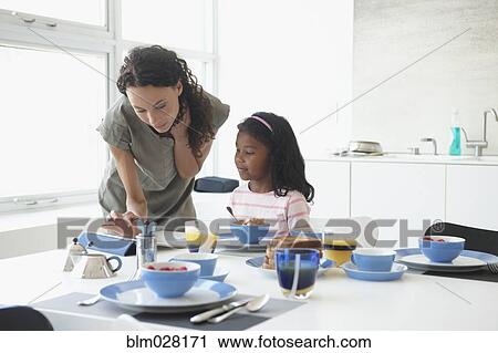 Mother and daughter at breakfast table View Large Photo Image Stock Image - Mother and daughter at breakfast table. Fotosearch