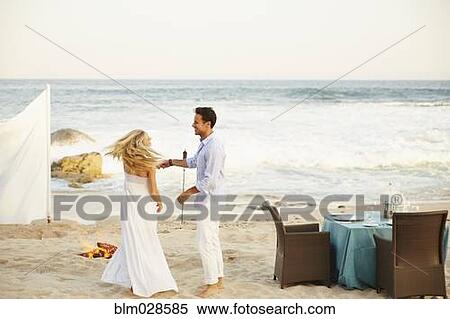 Newlywed couple dancing on beach View Large Photo Image Stock Photography - Newlywed couple dancing on beach. Fotosearch