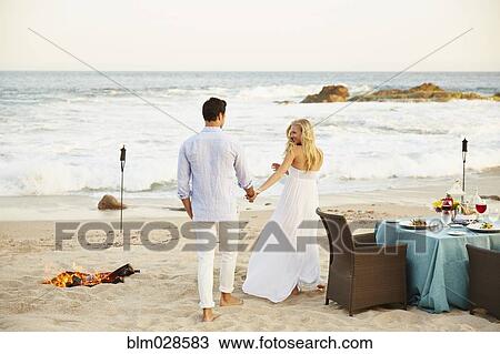 Newlywed couple on beach View Large Photo Image Stock Image - Newlywed couple on beach. Fotosearch