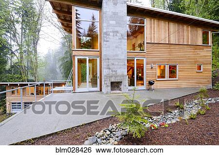 Stock Photograph - Outdoor fireplace of modern house. Fotosearch