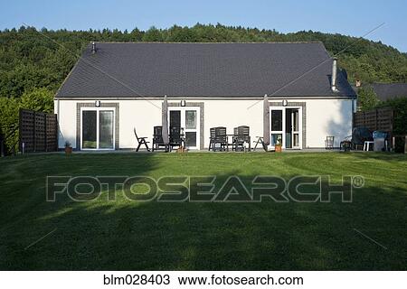 Patio and lawn outside house View Large Photo Image Stock Image - Patio and lawn outside house. Fotosearch
