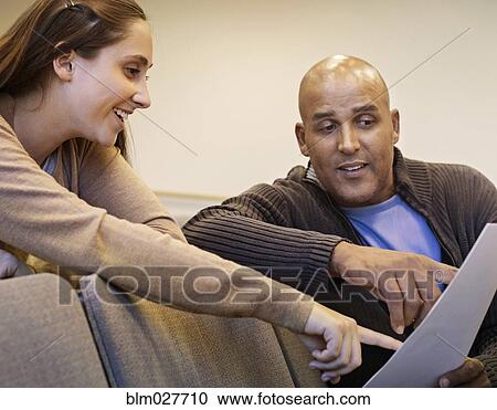 Professor and student reviewing essay View Large Photo Image Stock Image - Professor and student reviewing essay. Fotosearch