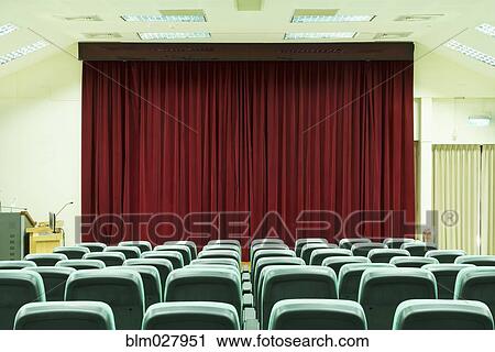 Stock Image - Seats in empty auditorium. Fotosearch