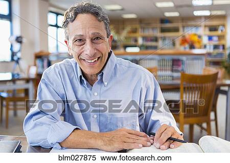 Senior man working in library View Large Photo Image Stock Photography - Senior man working in library. Fotosearch