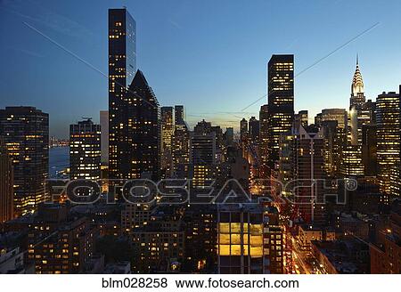 Stock Photo - Skyline lit up at night, New York, New York, United States. Fotosearch