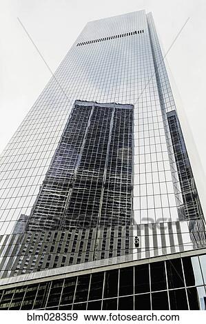 Skyscraper reflected in building windows, New York, New York, United States View Large Photo Image Stock Photo - Skyscraper reflected in building windows, New York, New York, United States. Fotosearch