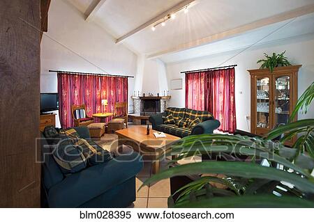Stock Photography - Sofas and coffee table in living room. Fotosearch