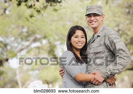 Soldier hugging girlfriend outdoors View Large Photo Image Stock Image - Soldier hugging girlfriend outdoors. Fotosearch