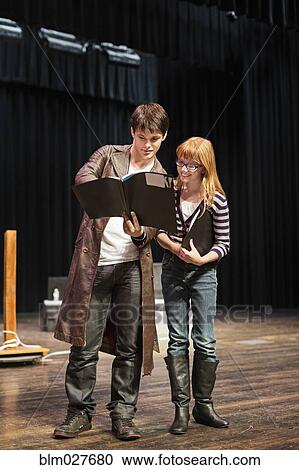 Stock Image - Student practicing lines on stage. Fotosearch