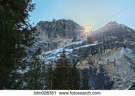 Sun rising over rocky landscape, Yosemite, California, United States View Large Photo Image Stock Image - Sun rising over rocky landscape, Yosemite, California, United States. Fotosearch