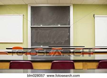 Tables and blackboard in empty lecture hall View Large Photo Image Stock Photo - Tables and blackboard in empty lecture hall. Fotosearch