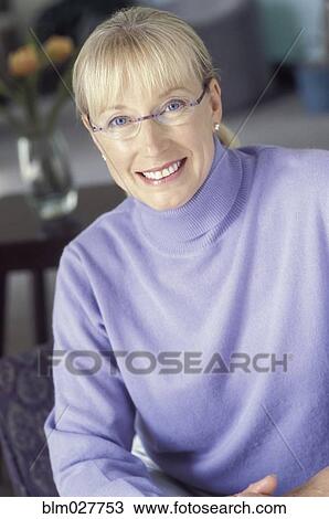 Woman smiling indoors View Large Photo Image Stock Image - Woman smiling indoors. Fotosearch