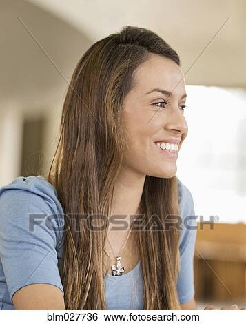 Woman smiling indoors View Large Photo Image Stock Photograph - Woman smiling indoors. Fotosearch