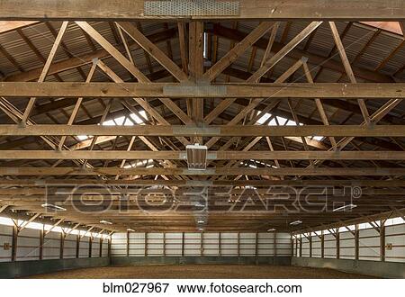 Wooden rafters in indoor horse riding ring View Large Photo Image Stock Photo - Wooden rafters in indoor horse riding ring. Fotosearch
