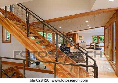 Wooden staircase in modern home View Large Photo Image Stock Image - Wooden staircase in modern home. Fotosearch