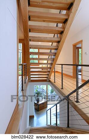 Stock Image - Wooden staircase in modern home. Fotosearch