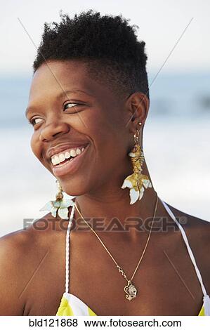 African American woman smiling on beach View Large Photo Image Stock Photo - African American woman smiling on beach. Fotosearch