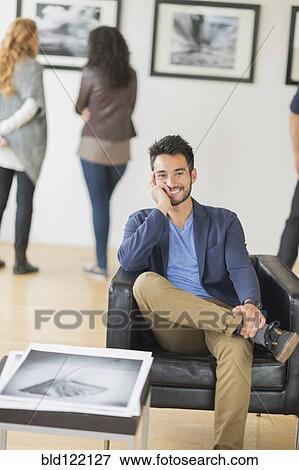 Artist smiling in art gallery View Large Photo Image Stock Photo - Artist smiling in art gallery. Fotosearch
