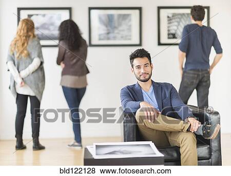 Artist smiling in art gallery View Large Photo Image Stock Photo - Artist smiling in art gallery. Fotosearch
