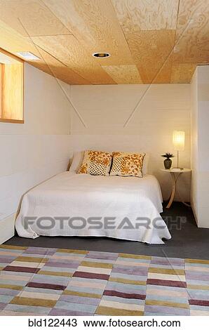 Bed and rug in modern bedroom View Large Photo Image Stock Image - Bed and rug in modern bedroom. Fotosearch