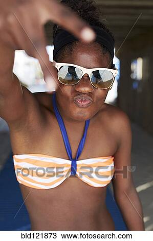 Black girl in bikini gesturing outdoors View Large Photo Image Stock Image - Black girl in bikini gesturing outdoors. Fotosearch