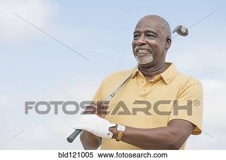Black man playing golf outdoors View Large Photo Image Stock Photography - Black man playing golf outdoors. Fotosearch