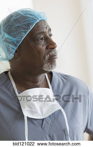 Black surgeon standing in hospital View Large Photo Image Stock Image - Black surgeon standing in hospital. Fotosearch