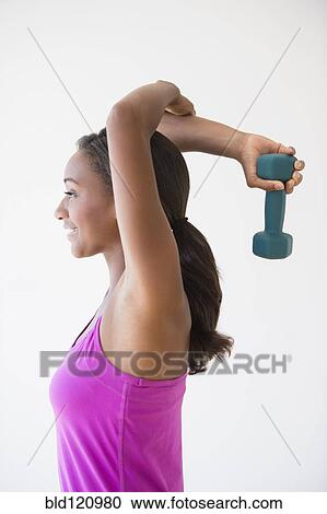 Black woman lifting weights View Large Photo Image Stock Image - Black woman lifting weights. Fotosearch