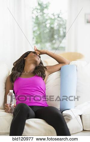 Black woman resting on sofa View Large Photo Image Stock Photo - Black woman resting on sofa. Fotosearch