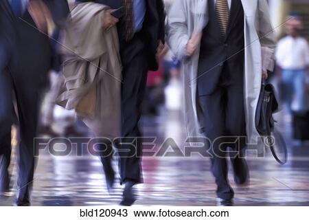 Blurred view of businessmen running on city street View Large Photo Image Stock Image - Blurred view of businessmen running on city street. Fotosearch