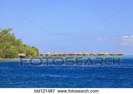 Stock Photo - Bungalows on tropical ocean, Bora Bora, French Polynesia. Fotosearch