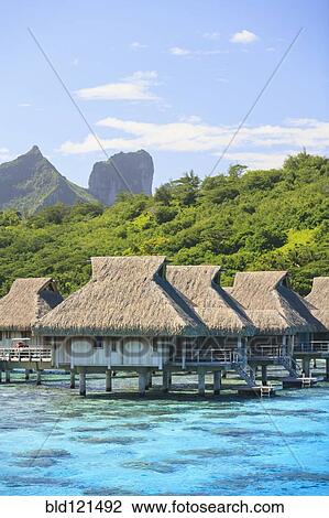 Bungalows over tropical ocean, Bora Bora, French Polynesia View Large Photo Image Stock Image - Bungalows over tropical ocean, Bora Bora, French Polynesia. Fotosearch