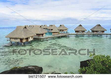 Stock Photo - Bungalows over tropical ocean, Bora Bora, French Polynesia. Fotosearch