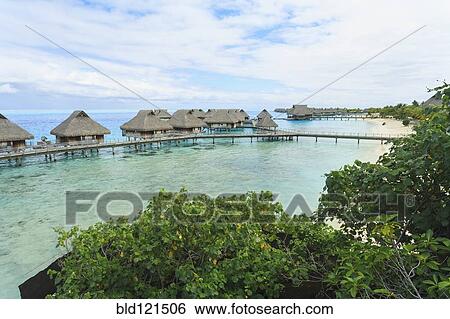 Bungalows over tropical ocean, Bora Bora, French Polynesia View Large Photo Image Stock Photograph - Bungalows over tropical ocean, Bora Bora, French Polynesia. Fotosearch