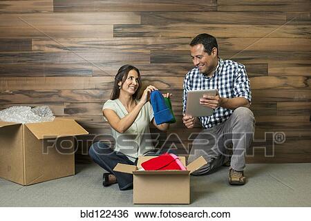 Business people using digital tablet in new office View Large Photo Image Stock Photograph - Business people using digital tablet in new office. Fotosearch