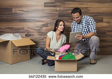 Business people using digital tablet in new office View Large Photo Image Stock Photography - Business people using digital tablet in new office. Fotosearch