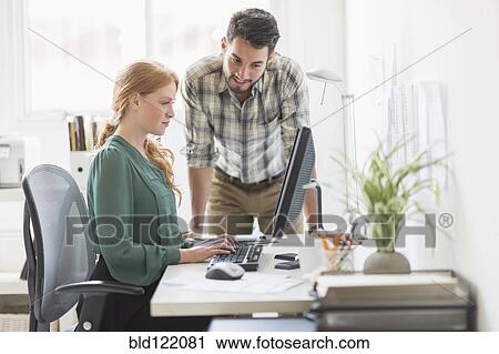 Business people working together in office View Large Photo Image Stock Image - Business people working together in office. Fotosearch