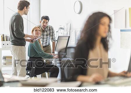 Business people working together in office View Large Photo Image Stock Image - Business people working together in office. Fotosearch
