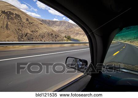 Car driving on road through Yakima River Canyon, Washington, United States View Large Photo Image Stock Photography - Car driving on road through Yakima River Canyon, Washington, United States. Fotosearch