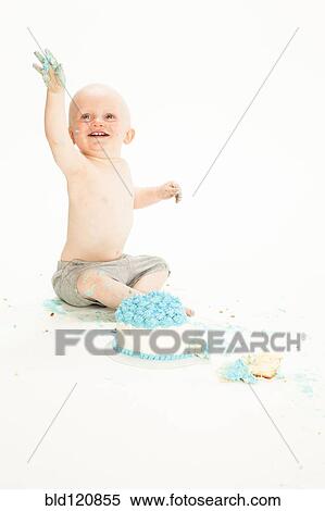 Caucasian baby boy playing with cake View Large Photo Image Stock Photography - Caucasian baby boy playing with cake. Fotosearch