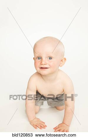 Stock Image - Caucasian baby crawling. Fotosearch