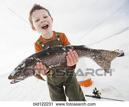 Caucasian boy holding fish in snow View Large Photo Image Stock Image - Caucasian boy holding fish in snow. Fotosearch